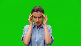 Woman with pain in her temples. American woman in blue shirt suffering from stress or headache grimacing in pain on green background. Medical concept. Alpha channel - Powered by Shutterstock - Get 15% off with code: PIKWIZARD15
