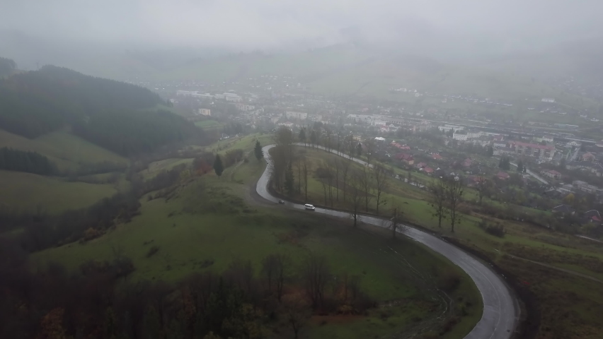 road on a hill in thick fog