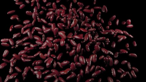 Flying red beans on a black background. Red beans. Super slow motion.