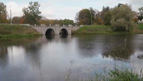 Pavlovsk Park, St. Petersburg, Mariental pond and stone bridge dam on Slavyanka River. High quality 4k footage