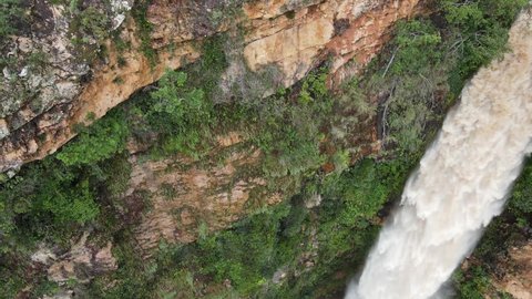 Beautiful aerial shot of waterfall in tropical forest. Salto do Itiquira Goiás Brazil. Big Waterfall in 4k