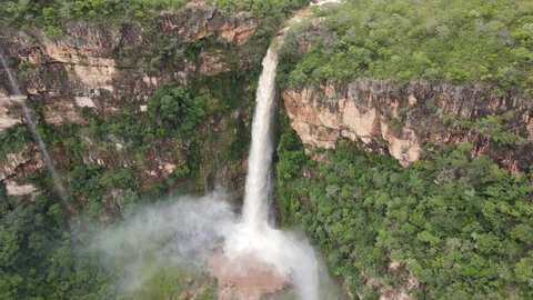 Beautiful aerial shot of waterfall in tropical forest. Salto do Itiquira Goiás Brazil. Big Waterfall in 4k