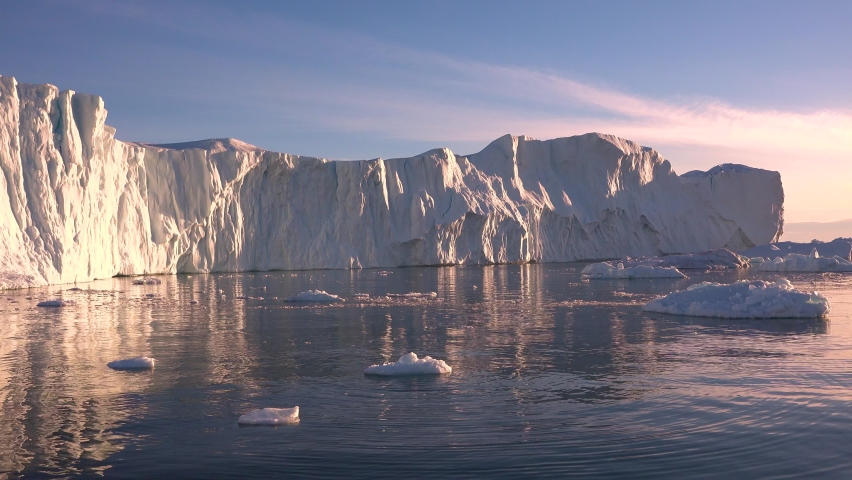Antarctica. Drifting icebergs. Cruise to the shores of Antarctica. Antarctica Iceberg in Sunset. | Shutterstock HD Video #1068138194