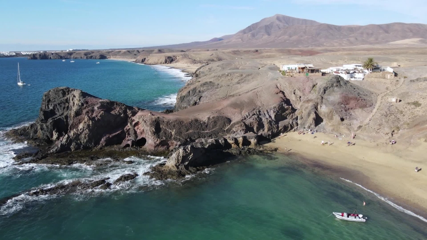Drone view at the coast of Papagayo beach on Canary island in Lanzarote, Spain
 | Shutterstock HD Video #1068147677