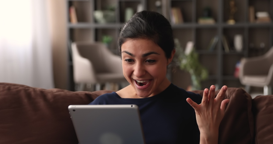 Surprised young happy indian woman looking at computer tablet screen, feeling excited of getting online lottery betting auction win notification, celebrating success at home, good luck concept. Royalty-Free Stock Footage #1068157247