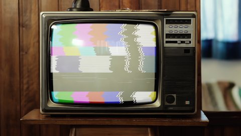 Vintage Television Set turning On Green Background with Color Bars, Noise and Static. Zoom Out. 4K Resolution.  