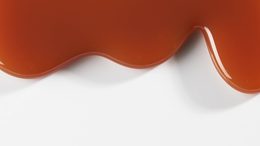 close up of flowing melted caramel sauce macro on white background Royalty-Free Stock Footage #1068166373