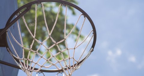 Basketball hoop with blue sky background 4k
