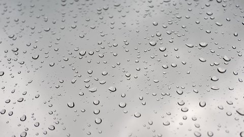 Cinematic 8K 7680X4320. Water drops of rain on wet window glass surface. Transparent blobs of rains on glass. Drop randomly sliding on windows. Will mix decently if blend mode set to luminosity. Aqua.