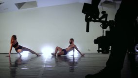 Modern dance recorded with motorized gimbal, videographer using dslr camera anti shake tool for stabilizer record video scene. Filming with professional camera video stabilization