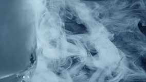 Curling low temperature steam and cold dry ice or frozen carbon dioxide. Cryogenic technology related slow motion shot - Powered by Shutterstock - Get 15% off with code: PIKWIZARD15