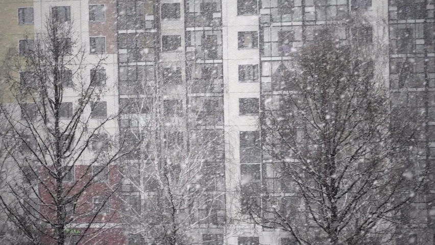 Magic snow in modern city. 250fps Slow Motion Snowfall.