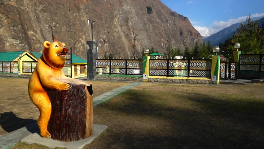 Beautiful footage of barren mountains with snow covered mountain