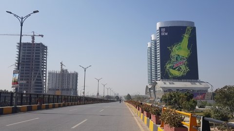 ISLAMABAD, PAKISTAN - February 28, 2021 - Traffic passing on Jinnah Avenue in federal capital Islamabad, Pakistan.