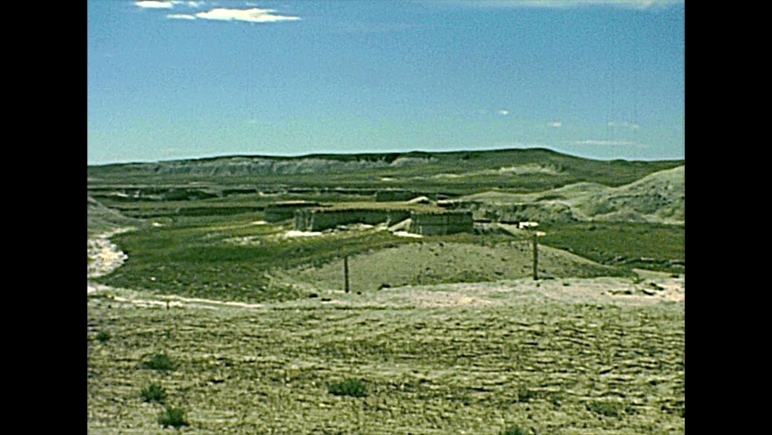 Badlands National Park, United States of America archival of South Dakota in 1977. Eroded rugged peaks in a sunny day blue sky. 1970s American travel destination in South Dakota.