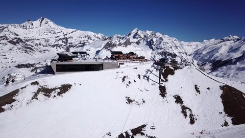 Tignes, France, Ski resort. Aerial footage. Drone 4k flyover skiers and chair lift. Winter sports and outdoor activities. 