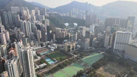 Aerial View of the skyline of Hong Kong Island Eastern Corridor at Victoria Harbour, Kings Road in Tin Hau and Fortress Hill