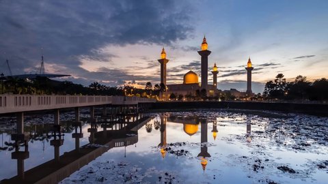 time lapse : majestic view of islamic mosque located in malaysia with reflection