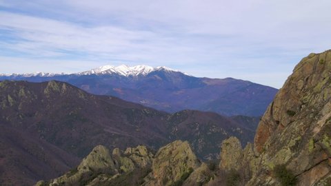 Aerial Fly over of mountain showing the Mount Canigou in the background