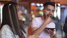 group of friends dining tacos at night in a street business - Powered by Shutterstock - Get 15% off with code: PIKWIZARD15