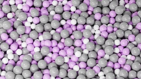Kids dry pool for fun games, candy dragee or sweet gumballs, colorful background of falling plastic glossy gray pink white balls, closeup texture, pile of toys for playground, 3d bubble pattern