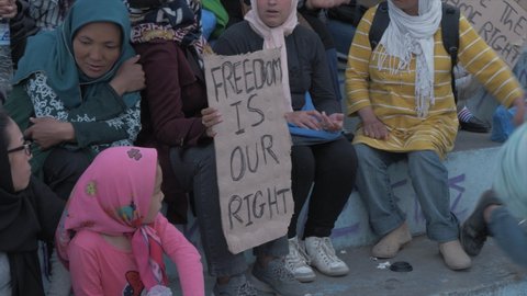 Mytilene , Lesvos , Greece - 04 22 2018: Afghan women protest in Sappho Square Mytilene holding signs, Lesvos following death of Afghan man
