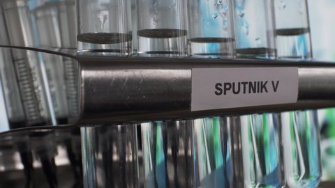 London , United Kingdom (UK) - 02 02 2021: Sputnik V Covid Vaccine In Test Tube Vials In Rack. Tilt Up, Close Up