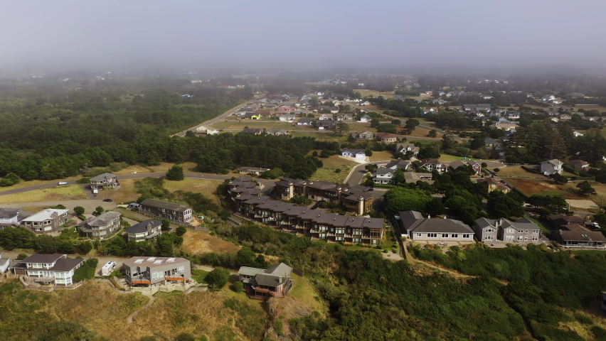 The Beautiful and Peaceful Scenery At The Colony, Bandon Oregon With Modern Houses Surrounded By Green Trees - Aerial Shot