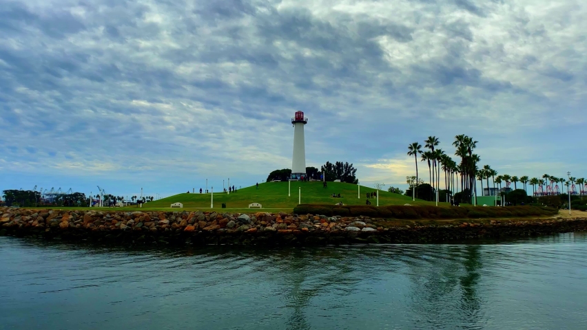 Panning up shot of the Light House in Long Beach California with some cool looking clouds.