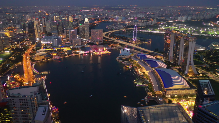 Twilight time illumination singapore city famous marina bay aerial panorama 4k | Shutterstock HD Video #1068239006