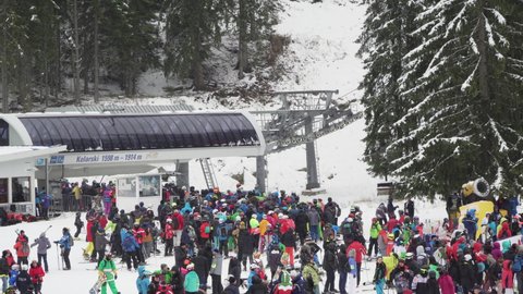 Bansko, Bulgaria - 14 Dec, 2019: Young skiers at opening new ski season in Bansko, Bulgaria.