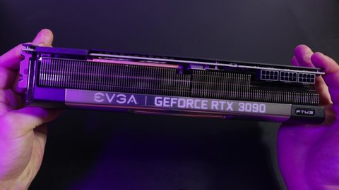 Budapest, Hungary - Circa 2020: Nvidia Geforce RTX 3090 Graphics Card made by EVGA held in hand. Model: EVGA Geforce RTX 3090 FTW3 ULTRA. High end Ampere architecture GPU, hard to find in 2020
