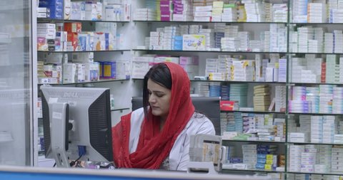 Muslim female community pharmacist busy in work at a local pharmacy. Islamabad, Pakistan, 2nd March 2020.
