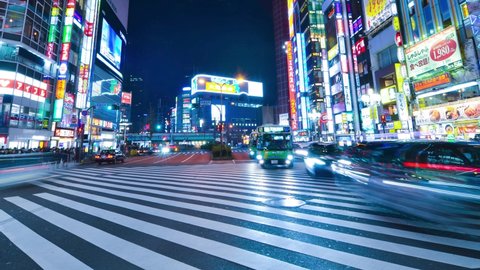 Jan1,2020:Shinjuku,Tokyo,Japan: Time-lapse of crowded people crossing road,car traffic at Kabukicho at Shinjuku Tokyo.Japan's entertainment night life.Tokyo famous tourist attraction.Tokyo Olympic2020