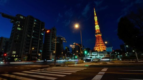 Time-lapse illumination view of Roppongi street with view of Tokyo Tower in night time. Night time Tokyo famous tourist attraction. 4K UHD video of Tokyo city in japan