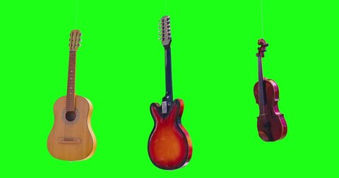 Many electric guitars and violin in different colors are hanging and rotating in the air in slow motion on green screen background. Musical instruments collection rolling horizontal in chroma key. 