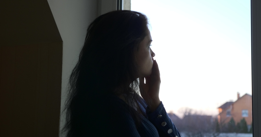 Distressed Woman Thinks Calms Down Relax after Stress Standing Near Window. Sad Emotions Royalty-Free Stock Footage #1068257624