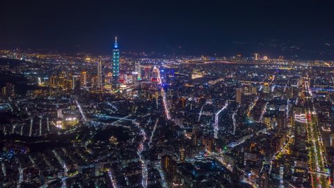 flight over taipei city downtown night illumination aerial panorama 4k timelapse taiwan