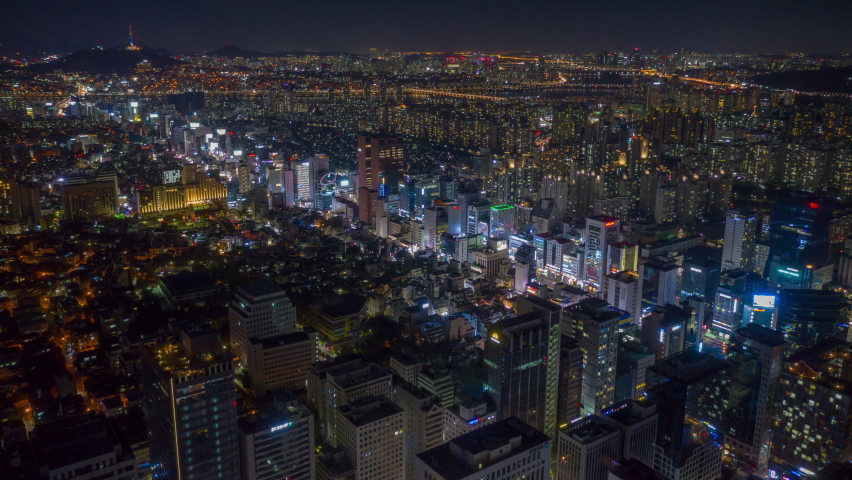 night illuminated flight over seoul city center traffic street aerial panorama 4k timelapse south korea