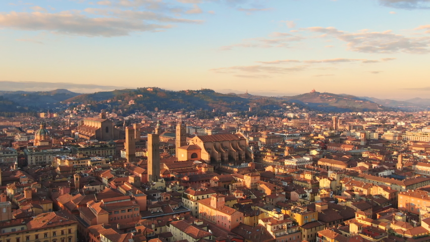 bologna skyline aerial view drone flying backwards over city center,italian town cityscape at dawn shot at sunrise Royalty-Free Stock Footage #1068261128