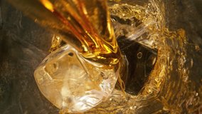 Super slow motion of pouring whiskey or rum with camera motion. Filmed on high speed cinema camera, 1000 fps. - Powered by Shutterstock - Get 15% off with code: PIKWIZARD15