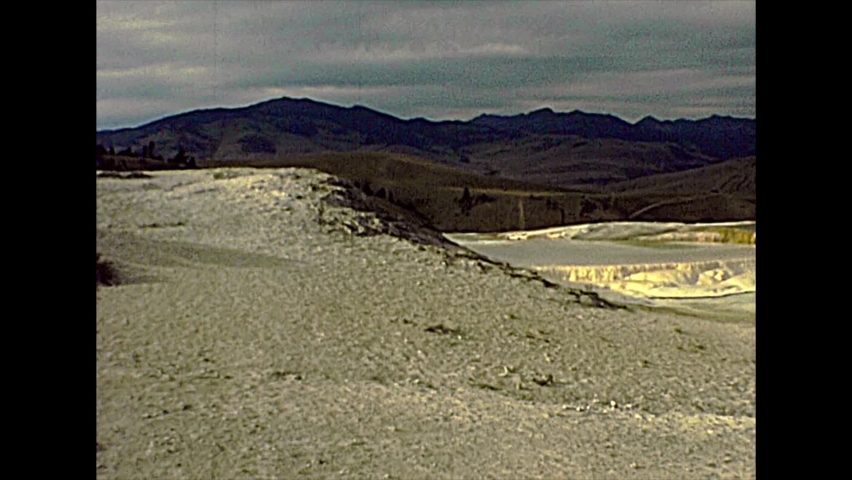 1970s travertine terraces rock formations made of crystallized calcium carbonate in Mammoth Hot Springs, Yellowstone National Park in Wyoming and Montana. United States of America archival in 1977.