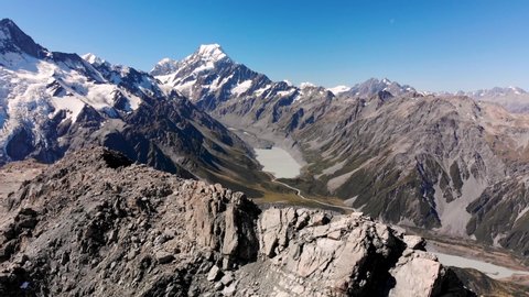 Flyover high mountain peak. Scenery of Southern Alps, New Zealand. Mt Cook