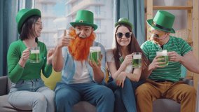 St. patrick's day a cheerful group of friends look at the camera - Powered by Shutterstock - Get 15% off with code: PIKWIZARD15