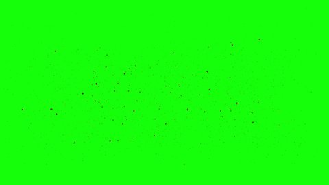 Many small piece of burning ash flying on green screen (4K,ultra high definition 2160p)