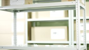 Worker puts a carton with product from Jordan on the shelf - Powered by Shutterstock - Get 15% off with code: PIKWIZARD15