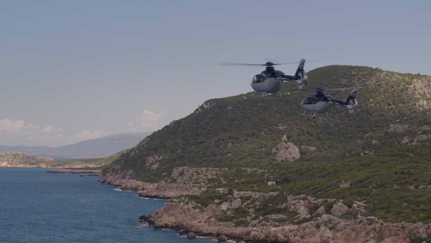 Private Helicopters Flying Over Ionian Sea and by Cliffs Cascading into Water