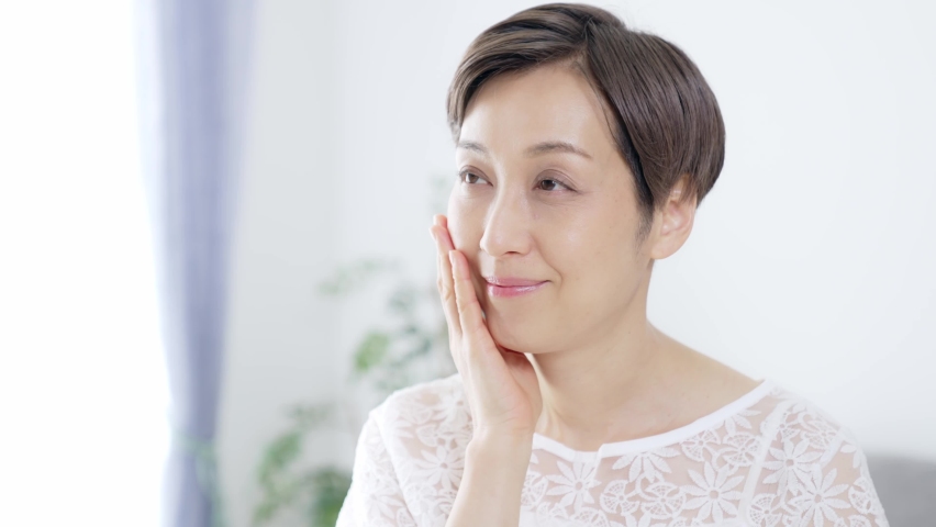 Beauty concept of middle-aged Asian woman. Skin care. | Shutterstock HD Video #1068317015