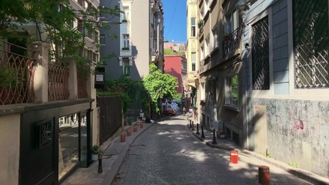 ISTANBUL - CIRCA JULY, 2019: Footage of a narrow street in Cukurcuma area of Taksim Beyoglu district of Istanbul. It is an old, historical neighborhood housing antique stores art galleries. 