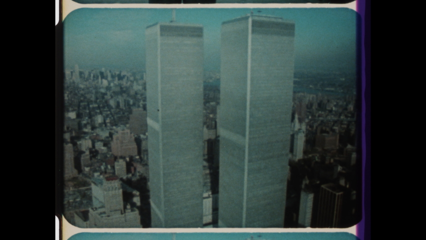 1980s Lower Manhattan, New York, NY. Aerial View of Iconic World Trade Center, WTC or Twin Towers. 4K Overscan of Vintage Archival 16mm Film Print